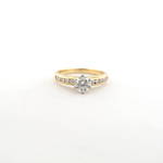 18ct yellow and white gold diamond solitaire ring with shoulder diamonds