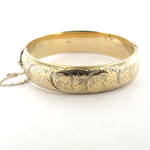 9ct yellow gold British hallmarked engraved hinged bangle