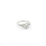 Platinum diamond solitaire ring with shoulder diamonds