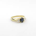 Lady's 18ct yellow gold sapphire and two diamond set ring
