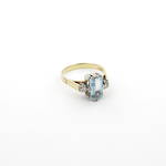18ct yellow/white gold aquamarine and three stone diamond ring