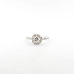 18ct while gold diamond set halo solitaire ring with shoulder diamonds