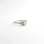 Platinum diamond solitaire ring with shoulder diamonds