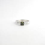18ct white gold green sapphire and baguette diamond ring