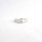 18ct white gold diamond solitaire ring with princess cut shoulder diamonds