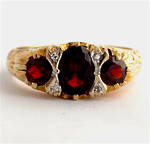 9ct yellow gold 'London Bridge' style 3 stone garnet and diamond set ring