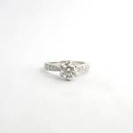 Platinum diamond solitaire ring set with shoulder diamonds & 2 pink sapphires