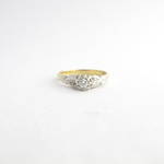 18ct yellow gold, platinum and palladium diamond solitaire ring