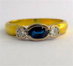 18ct yellow and white gold sapphire and diamond rub over set ring