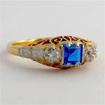 18ct yellow gold/platinum zircon and synthetic sapphire set dress ring