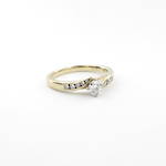 18ct yellow and white gold diamond solitaire cross over style ring with shoulder diamonds